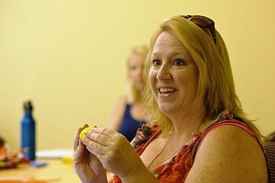 A participant at the Summer Institute uses a manipulative.