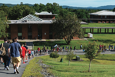 View of Landmark College upper campus with student traveling down the hill in a line. 